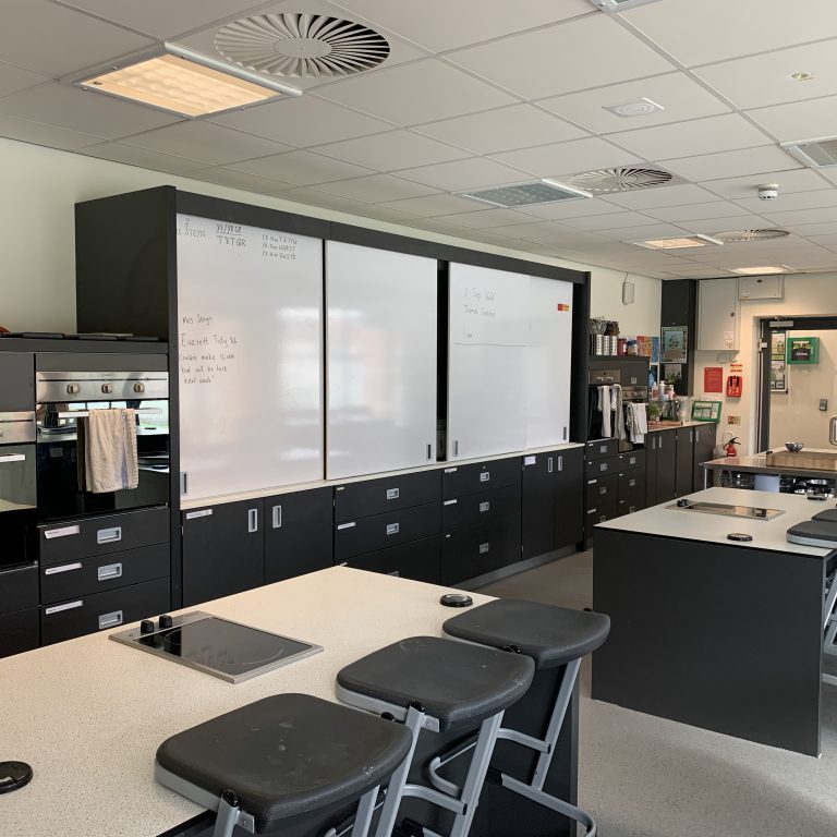 cooking space with whiteboards and ovens to use